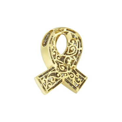 Close-up front view of a yellow metal ribbon-shaped necklace pendant with intricate scrollwork and channel-set white round and baguette gemstones.