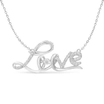 Close-up front view of a white metal necklace pendant spelling 'Love' adorned with multiple round white gemstones in prong settings on the letters, including one prominent round white gemstone inside the 'o'.