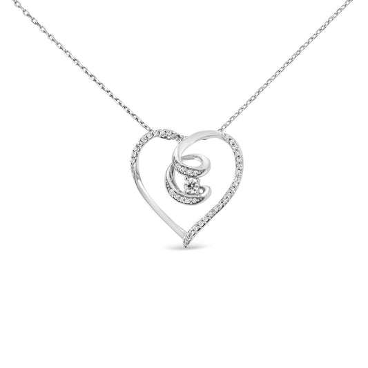 Front view of a white metal heart-shaped necklace pendant with a swirl design inside, accented with prong-set round white gemstones along the edges and a single larger gemstone in the center, on a matching chain.