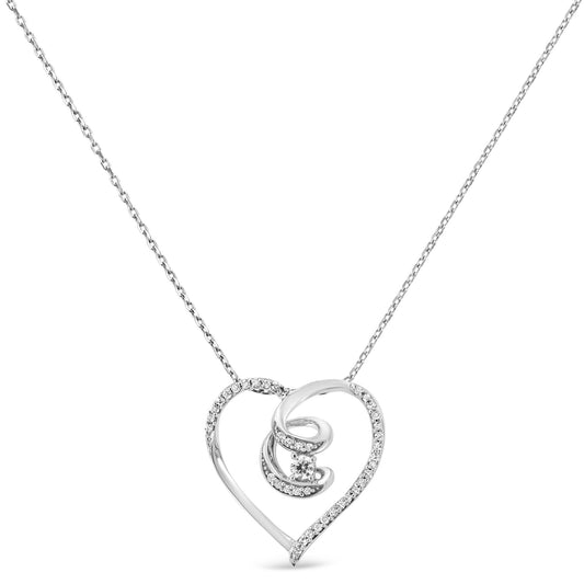 Front-facing shot of a white metal heart-shaped necklace pendant with an open design, adorned with small white gemstones along part of the heart and a swirl inside featuring a single larger white gemstone, shown on a delicate chain.