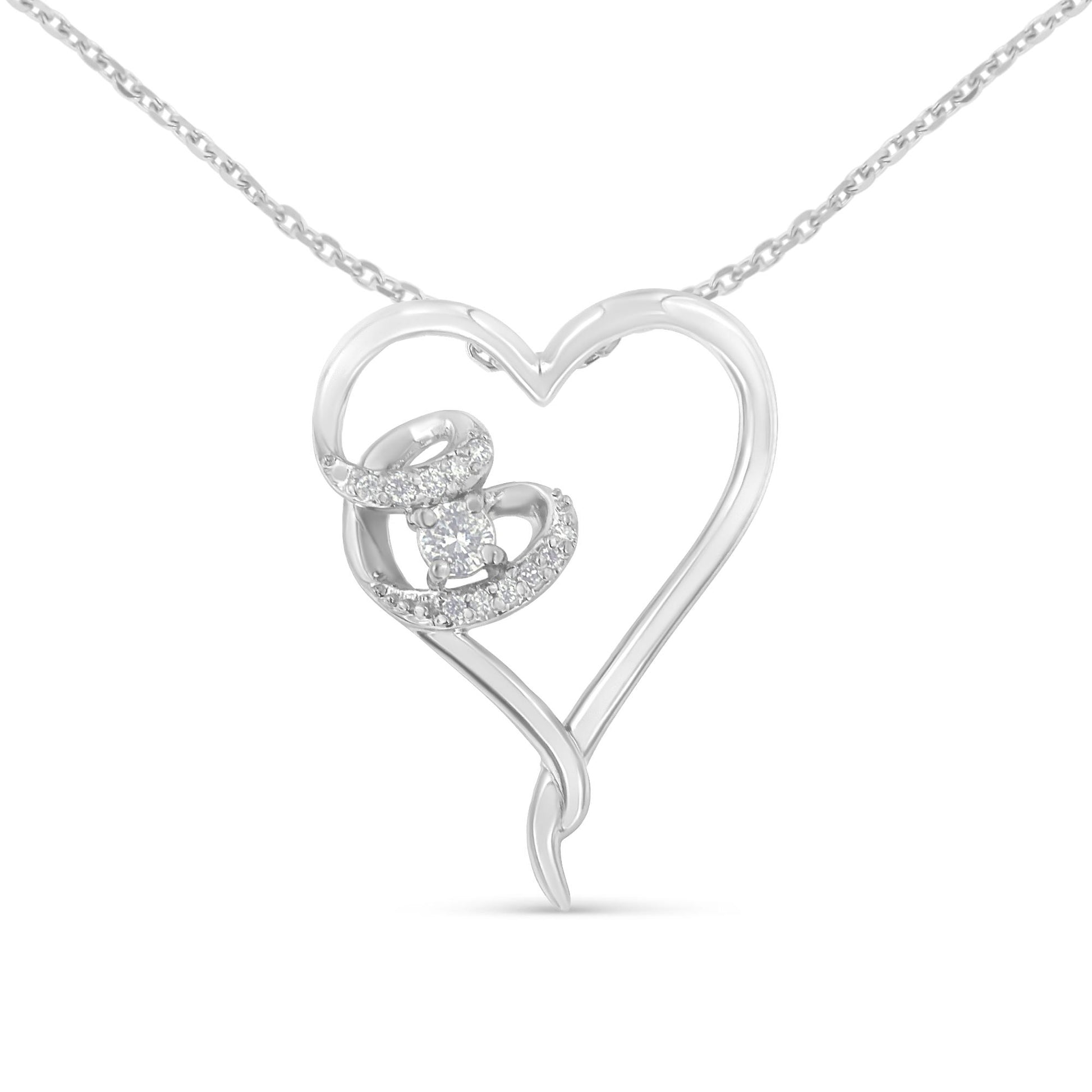 Front view of a white metal heart-shaped necklace pendant with a swirl design on one side featuring a total of white round gemstones in prong settings.