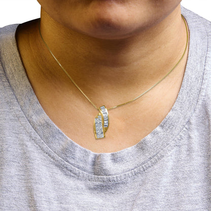 Necklace with a yellow metal chain and a modern pendant featuring two overlapping curved sections, one set with white baguette-shaped gemstones in a channel setting and the other with white princess-shaped gemstones in an invisible setting, worn on a model, close-up front view.