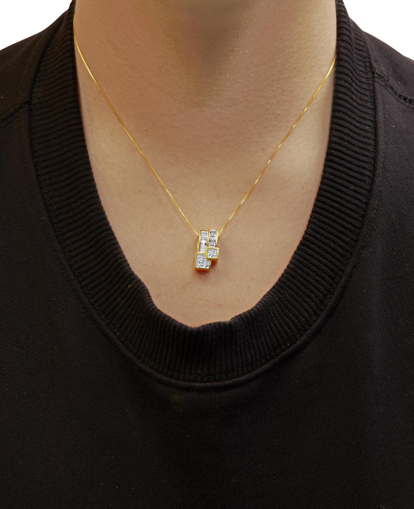 Yellow necklace with a pendant featuring white baguette-shaped gemstones in a channel setting and white princess-shaped gemstones in an invisible setting, worn on a model, front-facing angle.