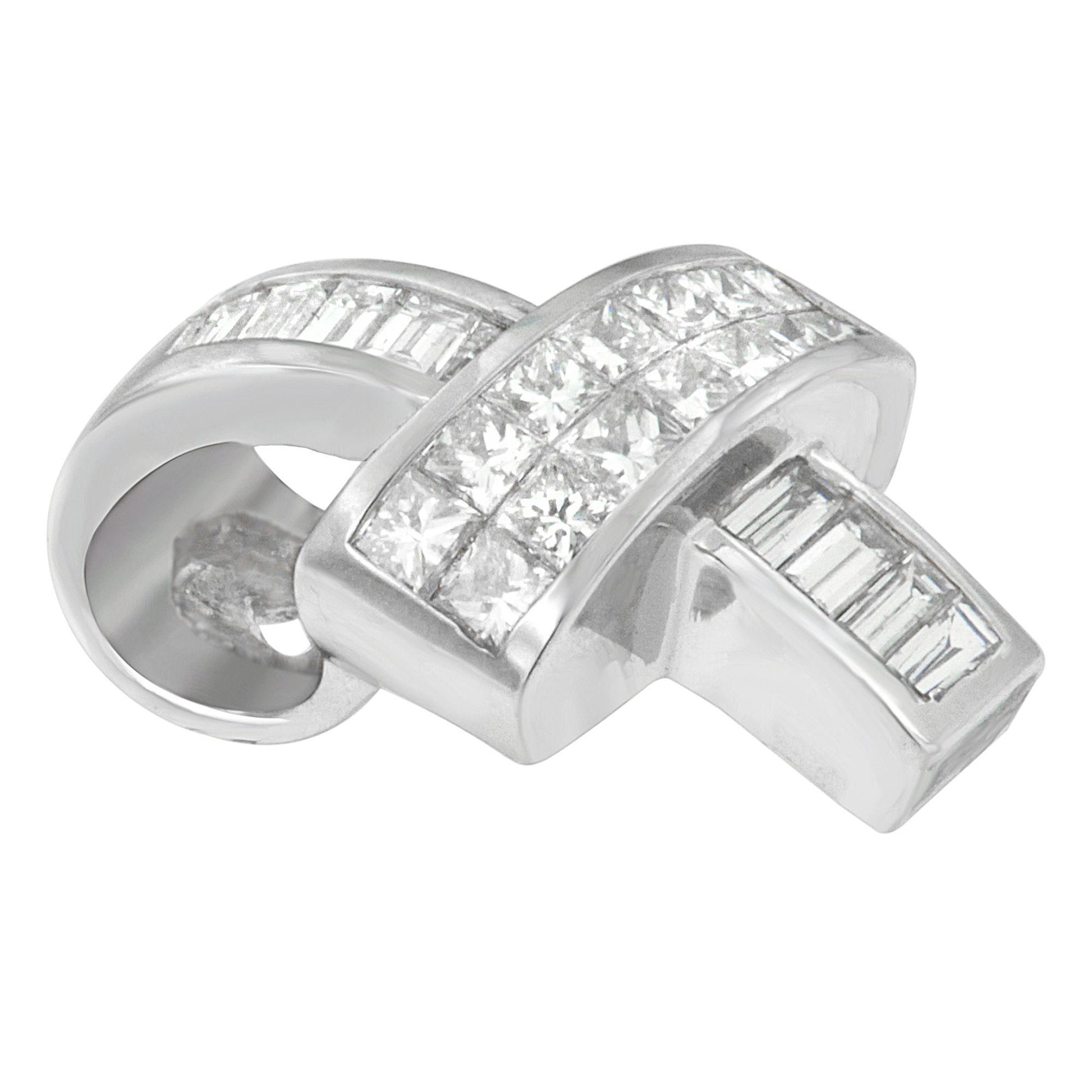 Close-up angled view of a white metal necklace pendant featuring channel-set white gemstones in princess and baguette shapes.