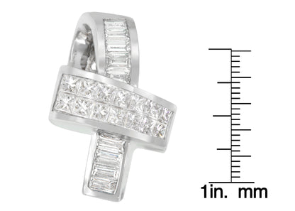 Close-up front angle of a white metal necklace pendant with channel-set white princess shape and baguette shape gemstones, shown next to a ruler for size reference.