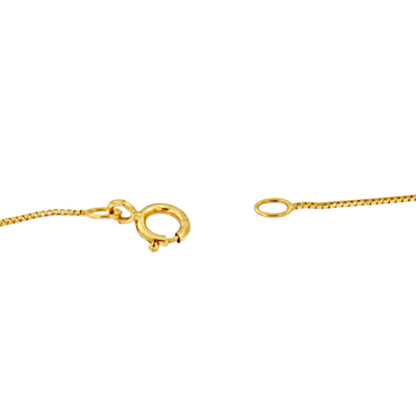 Close-up front angle of a yellow necklace clasp and chain ends against a white background.