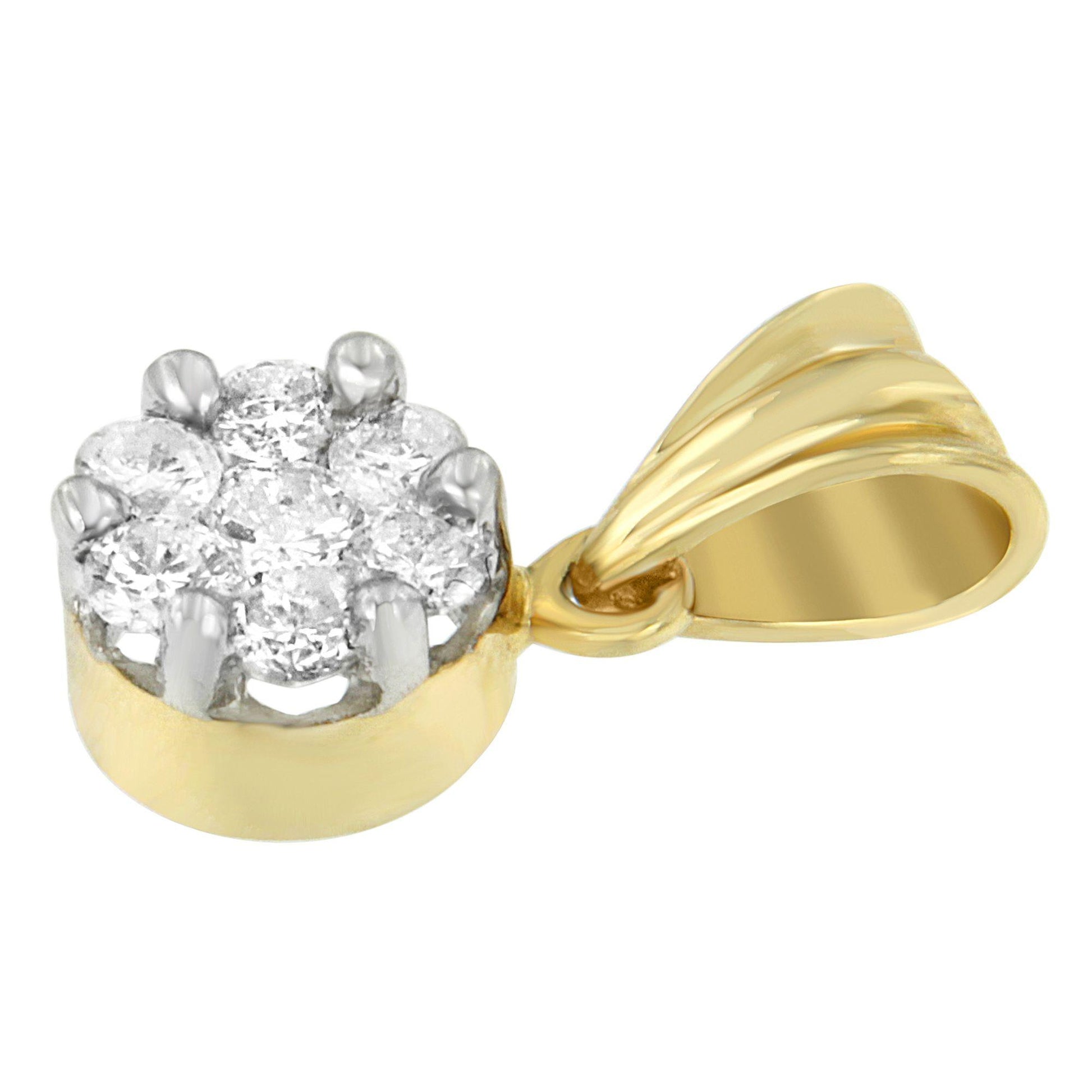 Close-up angled view of a yellow metal necklace pendant with a cluster of round white gemstones in prong settings.