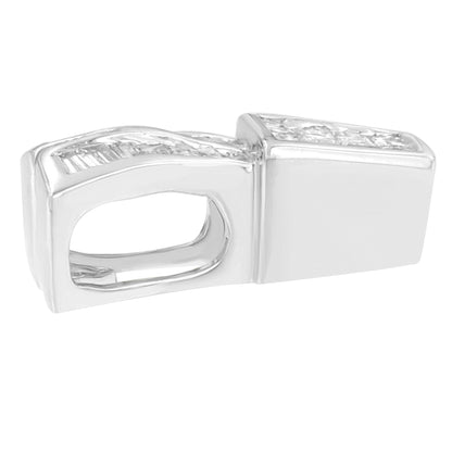 Close-up side view of white metal necklace clasp with channel-set white gemstones in princess and baguette shapes.