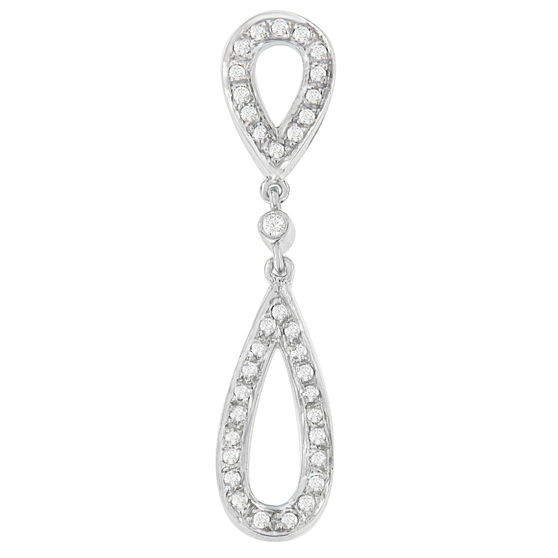 Front-facing close-up of a white metal necklace pendant with two linked teardrop shapes, each outlined with round white gemstones in prong settings.