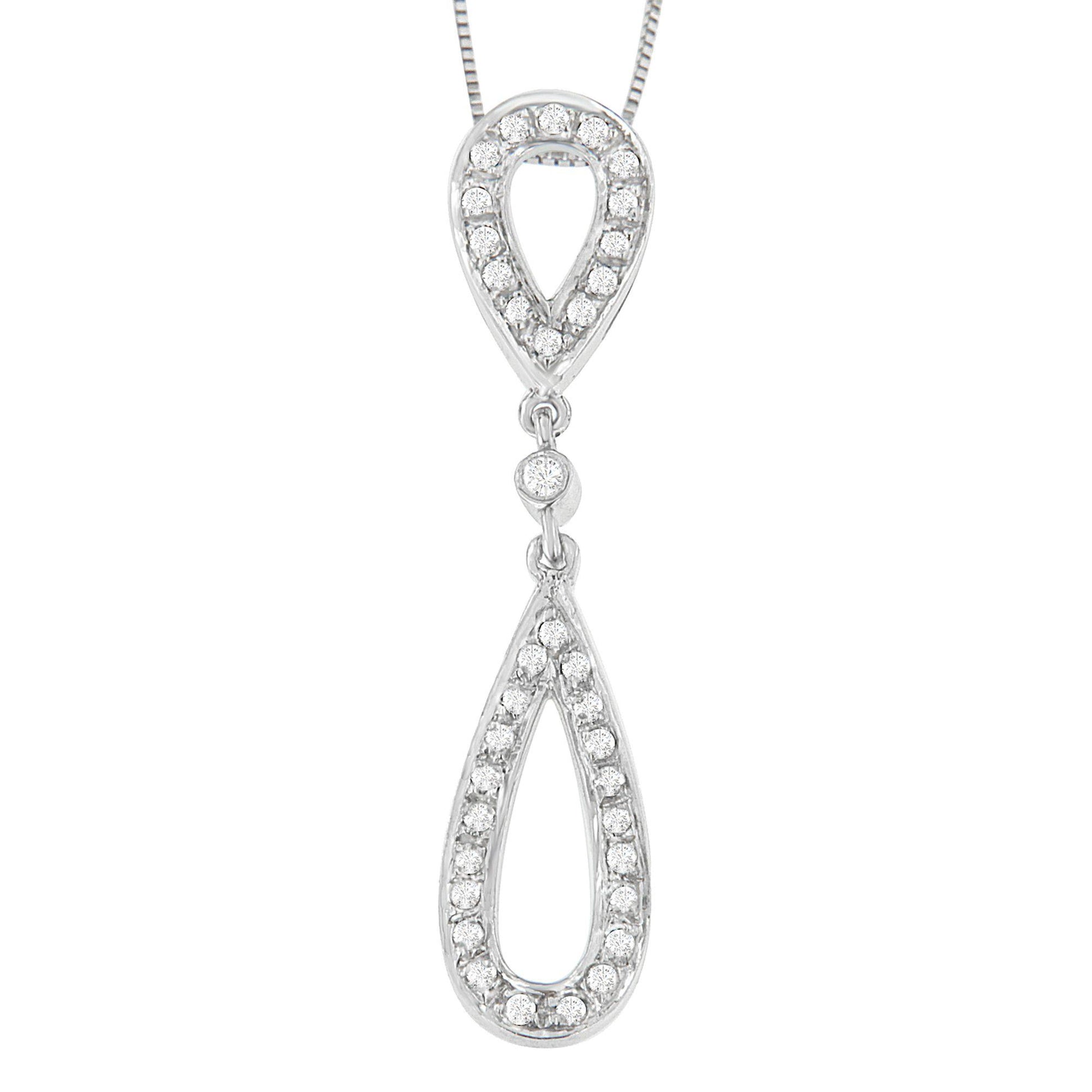 Front view of a white metal necklace pendant with two linked teardrop shapes outlined with round white gemstones in prong settings.