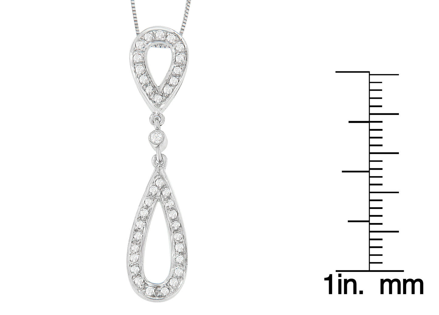 Close-up front view of a white necklace with two connected teardrop-shaped pendants, each outlined with round white gemstones in prong settings, shown next to a ruler for size reference.