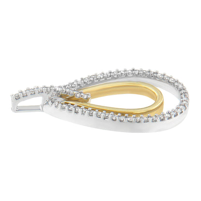 Close-up side angle of a two-toned teardrop-shaped necklace pendant featuring a white outer layer with round white gemstones in prong settings and a smooth gold-toned inner loop.