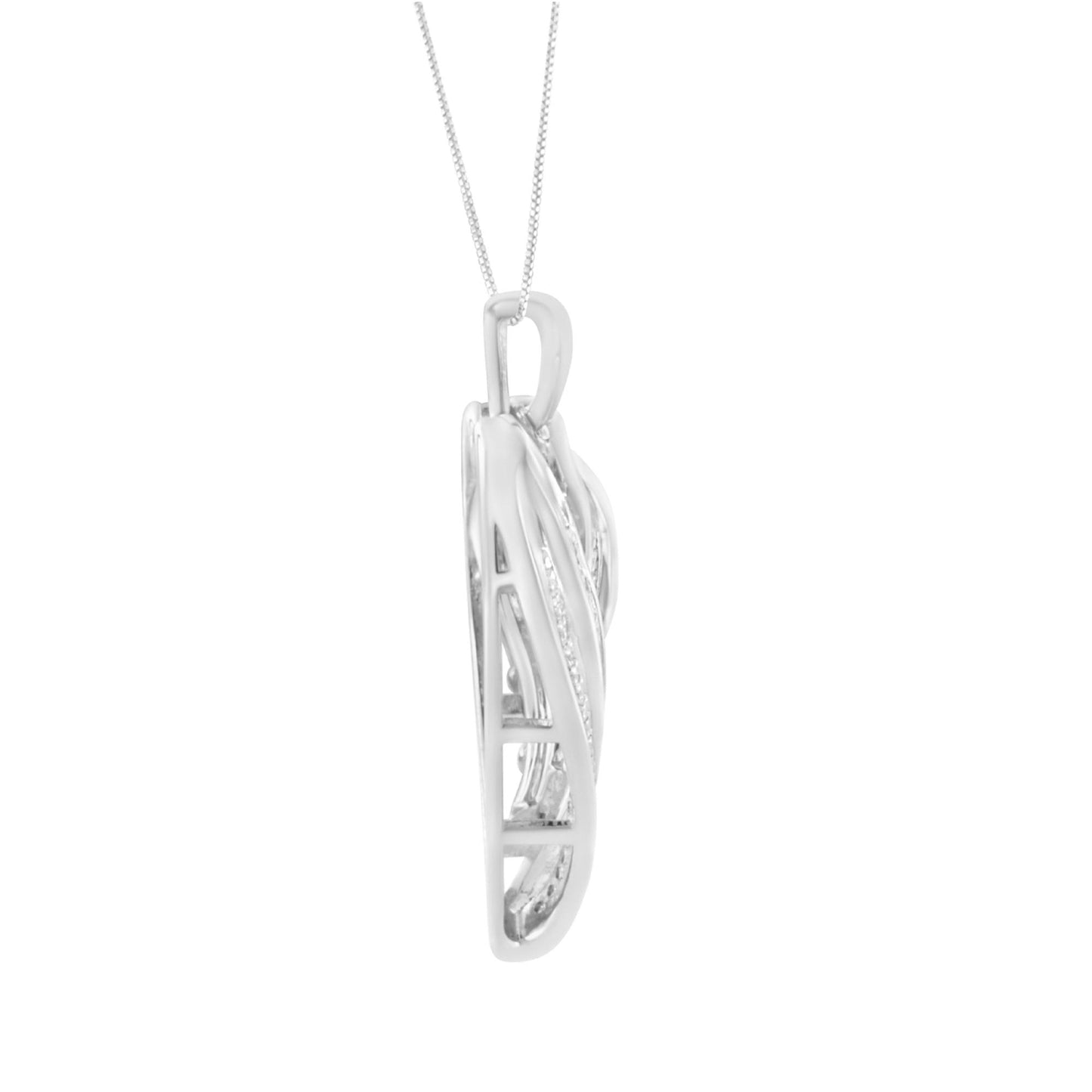 Side view of white metal necklace pendant with intertwined design, featuring round and baguette white gemstones, hanging on a chain.