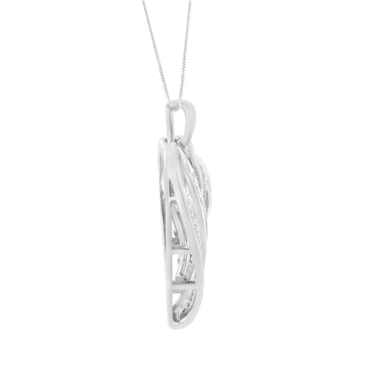 Side view of white metal necklace pendant with intertwined design, featuring round and baguette white gemstones, hanging on a chain.