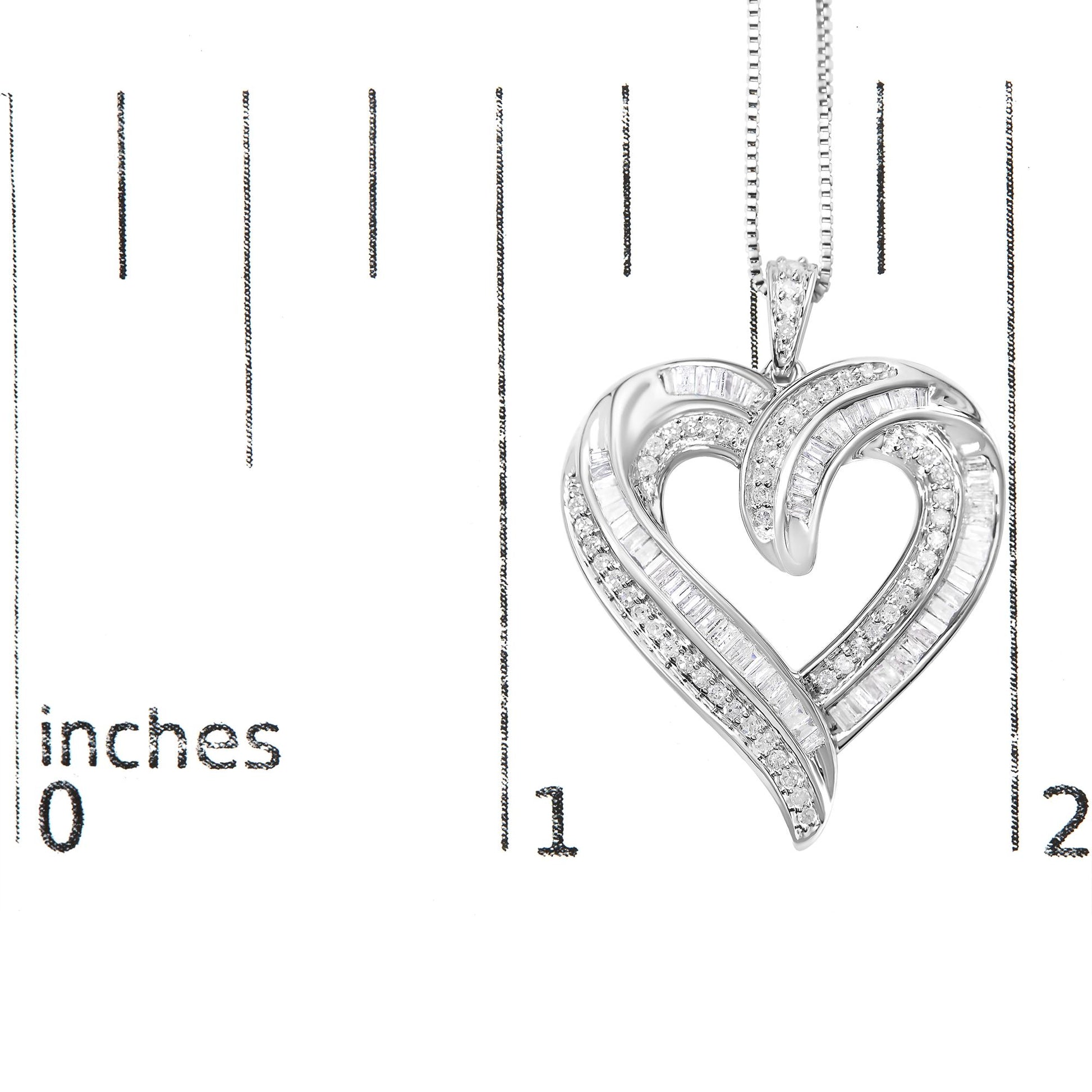 Close-up front view of a white metal heart-shaped necklace pendant adorned with round and baguette white gemstones in prong and channel settings, displayed on a ruler for size reference.