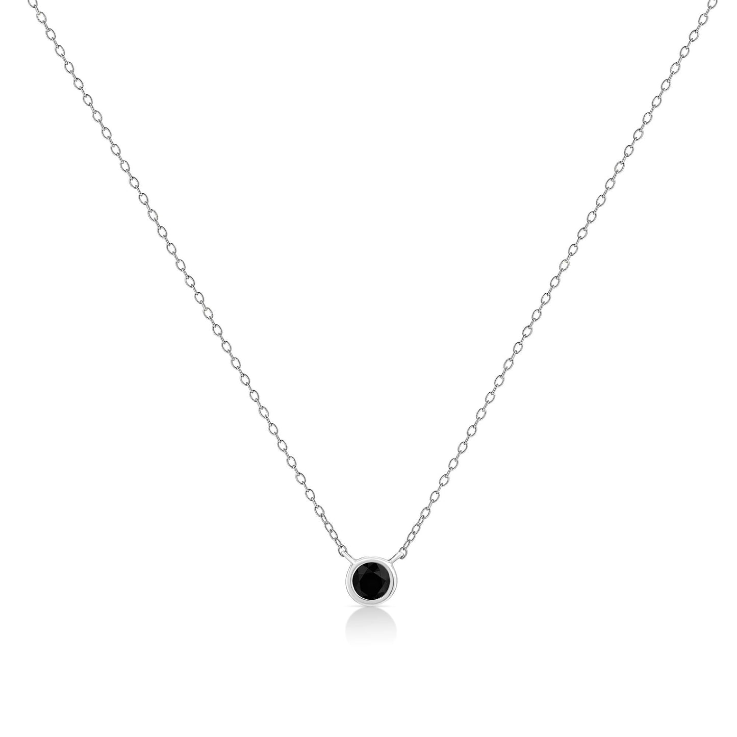 Front view of a white metal necklace with a single round black gemstone in a bezel setting pendant.