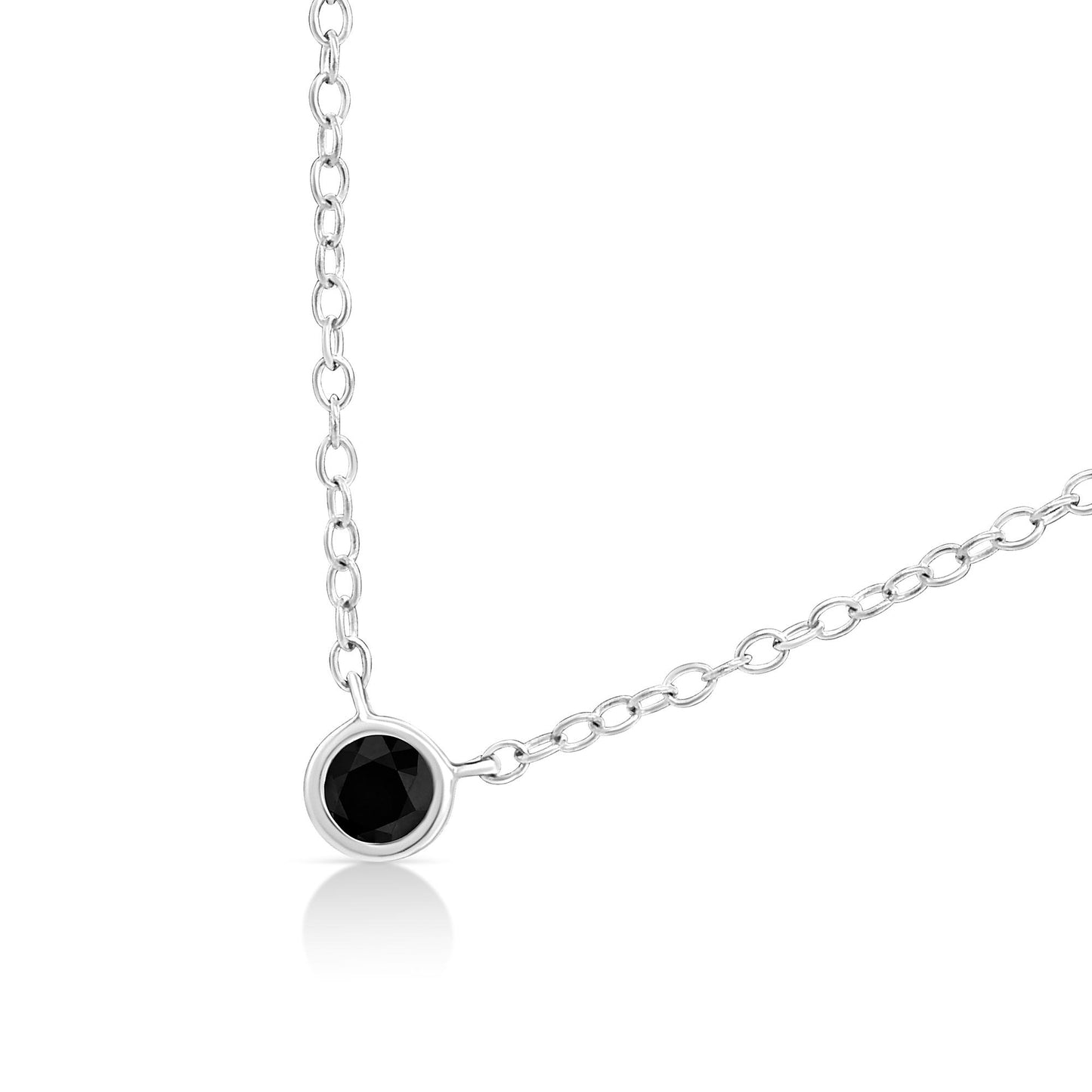 Close-up front view of a white metal necklace with a single round black gemstone in a bezel setting.