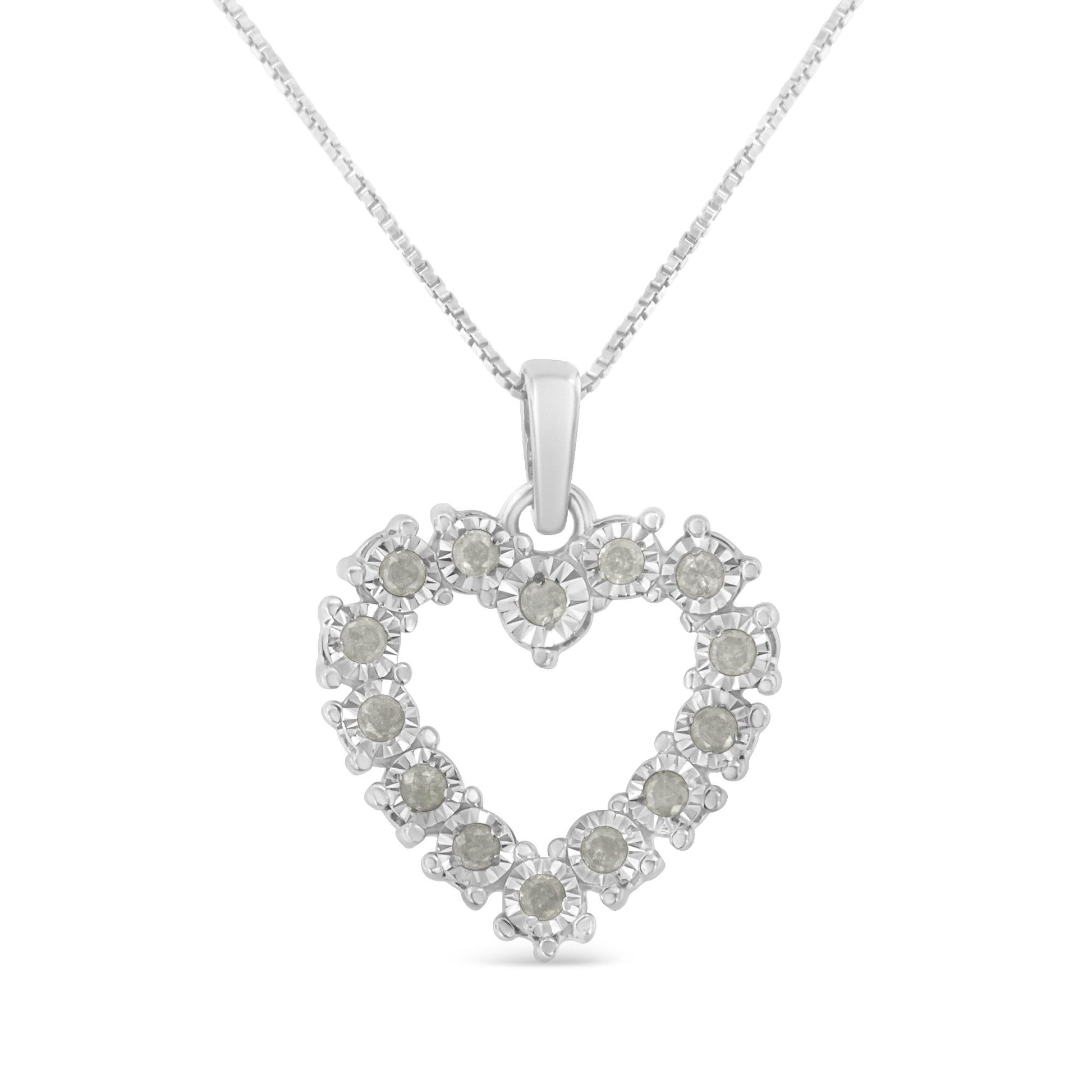 Front view of a white necklace with a heart-shaped pendant featuring round white gemstones in a miracle setting.