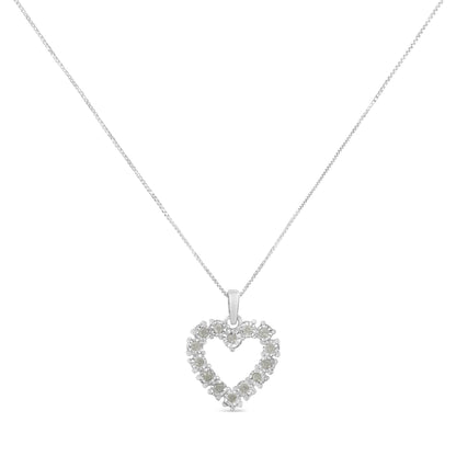 Front-facing shot of a white metal necklace with a heart-shaped pendant set with round white gemstones in a miracle setting.