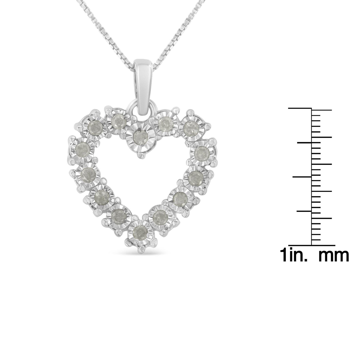 Front view of white metal heart-shaped necklace pendant with round white gemstones in miracle setting, shown with ruler for size reference.