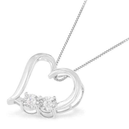 Close-up front angle of a white metal heart-shaped necklace pendant with two round white gemstones in miracle settings on a matching chain.