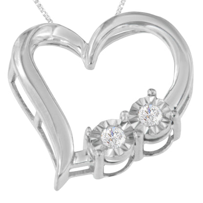 Close-up front angle of a white metal heart-shaped necklace pendant featuring two round white gemstones in miracle settings.
