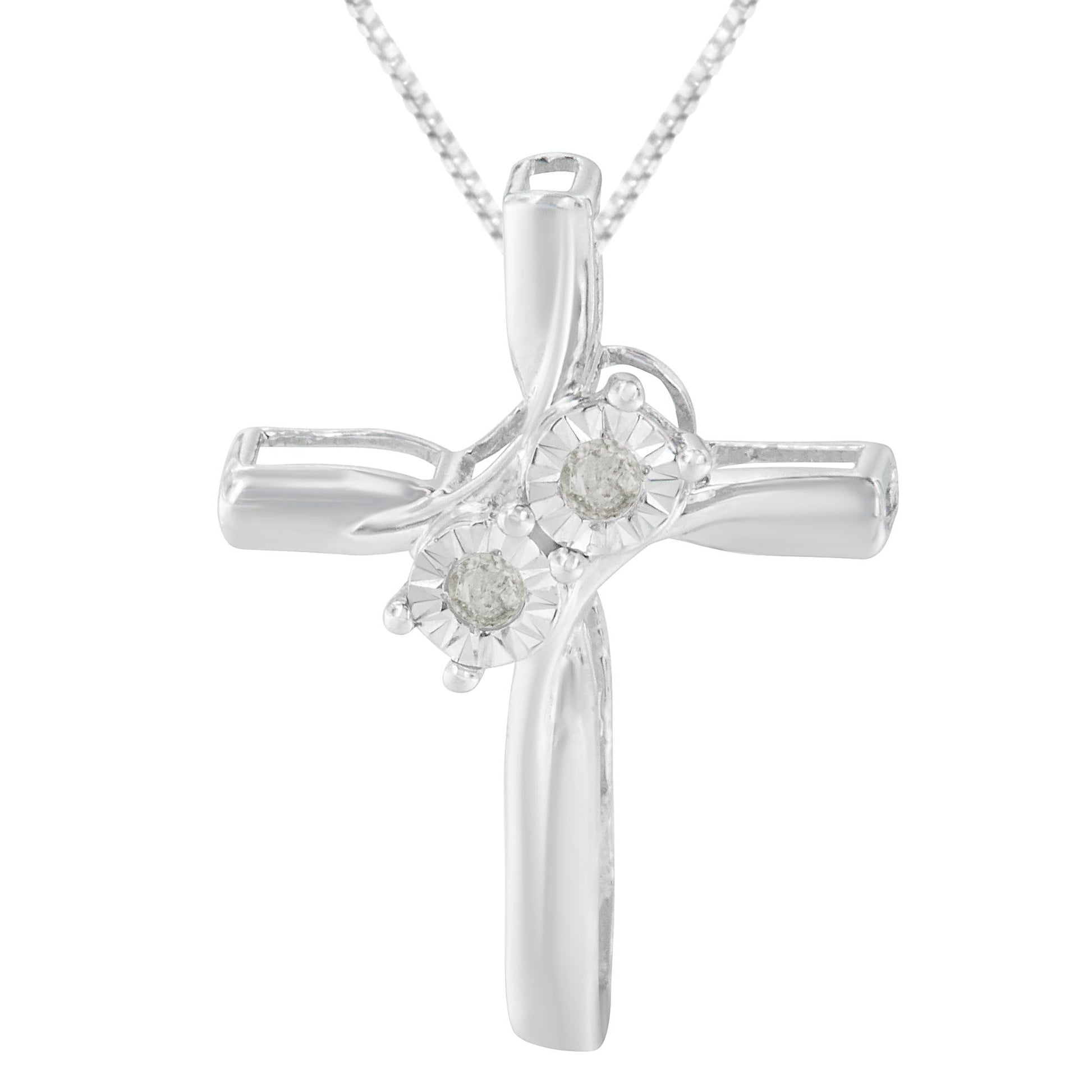 Front-facing close-up of a white metal cross necklace pendant featuring two round white gemstones in a miracle setting.