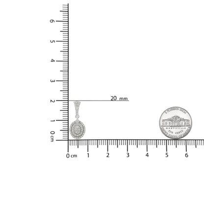 White metal necklace pendant with round white gemstones in prong setting, shown on a ruler and coin for size reference, front angle.