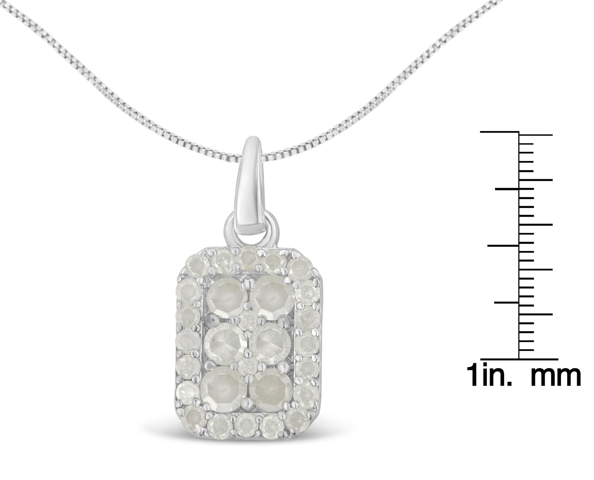 Front view of white metal necklace with rectangular pendant featuring round white gemstones in prong settings, shown with a ruler for size reference.