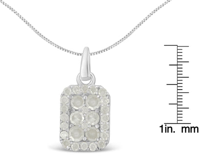 Front view of white metal necklace with rectangular pendant featuring round white gemstones in prong settings, shown with a ruler for size reference.