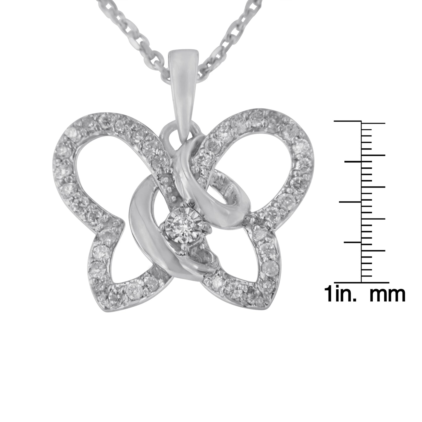 White metal butterfly-shaped necklace pendant with multiple round white gemstones in prong settings, shown close-up with a size ruler, photographed from the front.