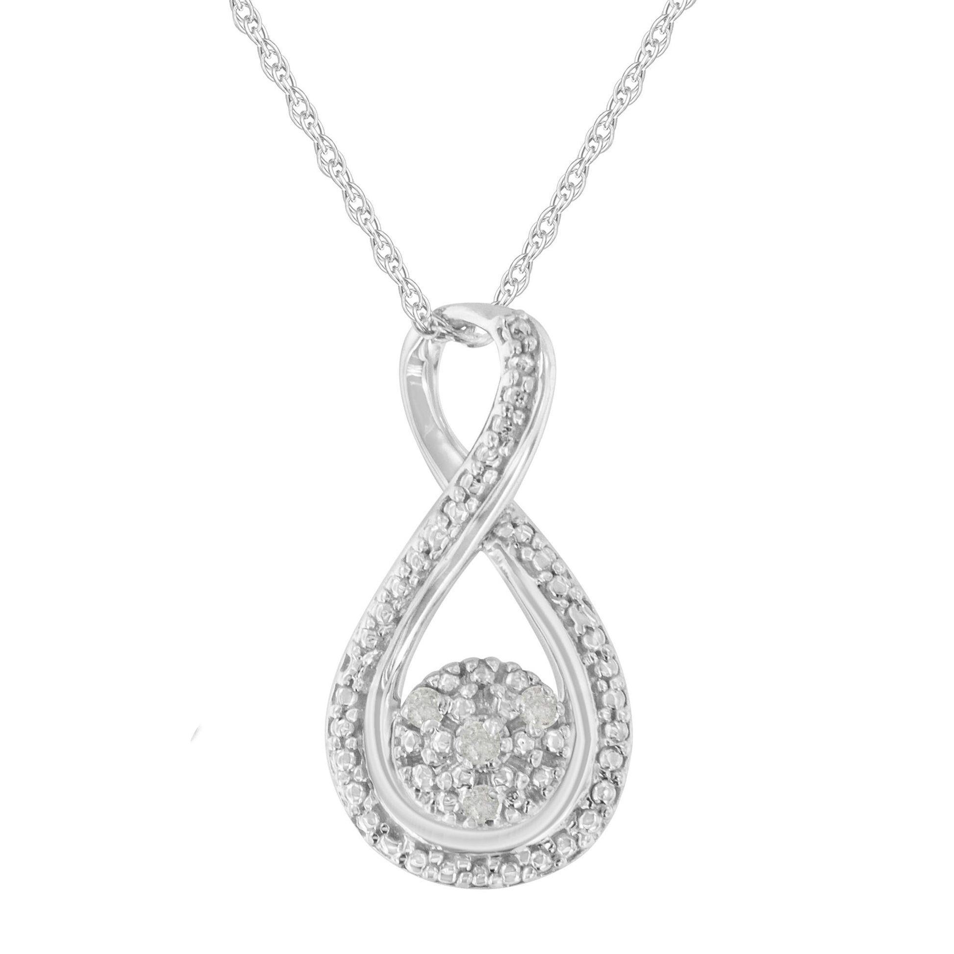 Front view of a white metal necklace with an infinity loop-shaped pendant featuring small round white gemstones in prong settings along the loop and clustered in the center.