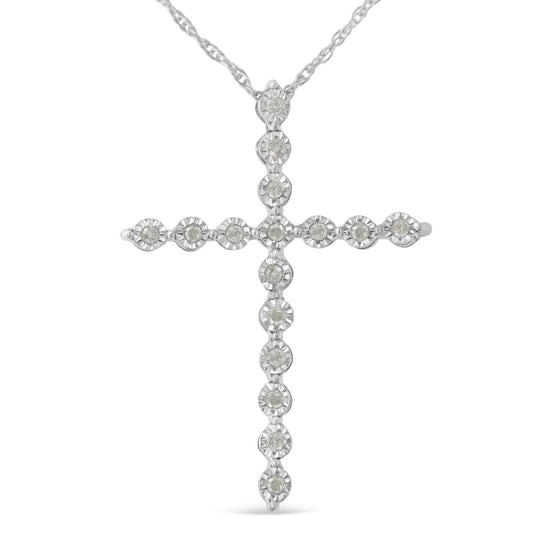 Front view of a white metal cross necklace pendant set with round white gemstones in a miracle setting on a white background.