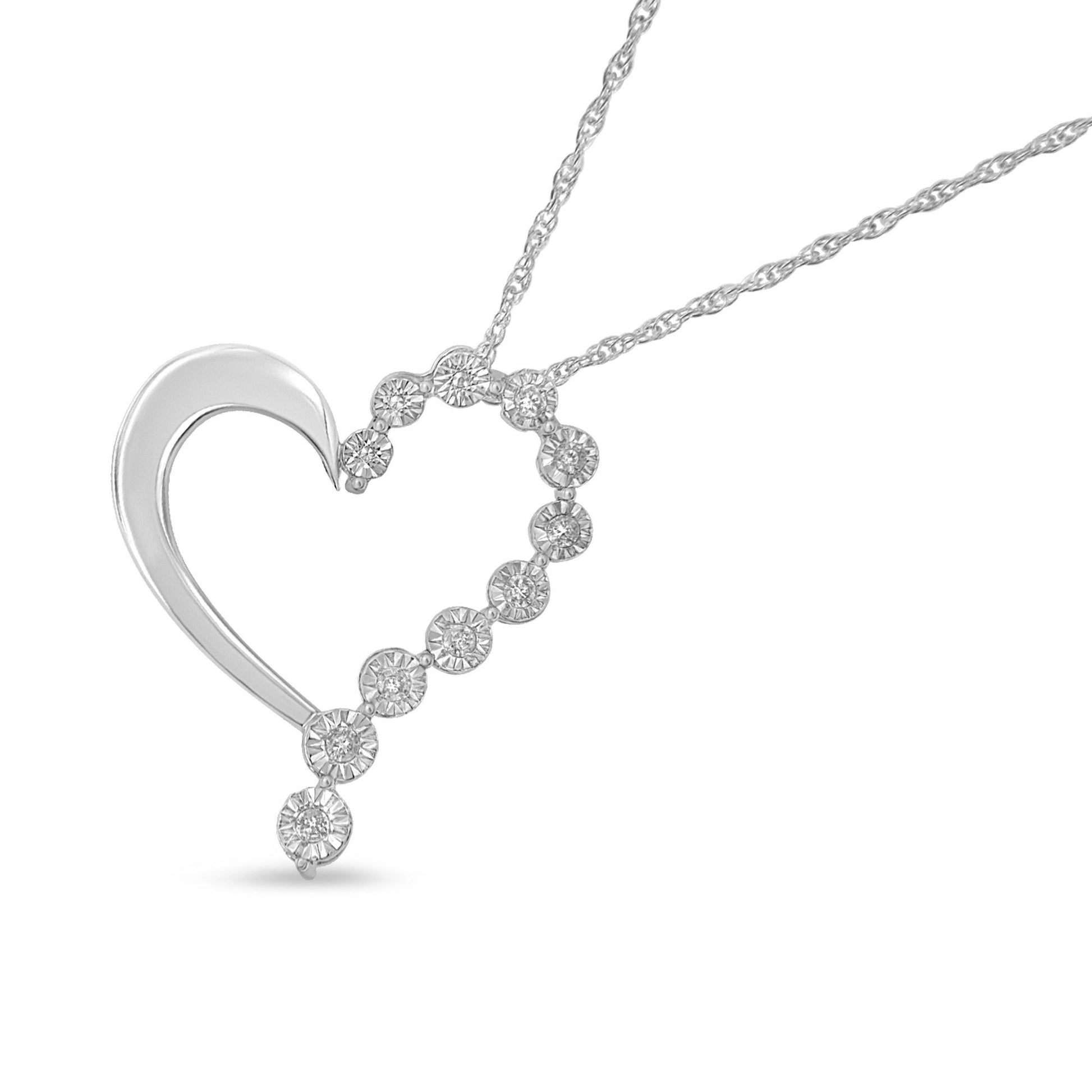 White metal heart-shaped necklace pendant with round white gemstones in a miracle setting, photographed at a slight front angle.