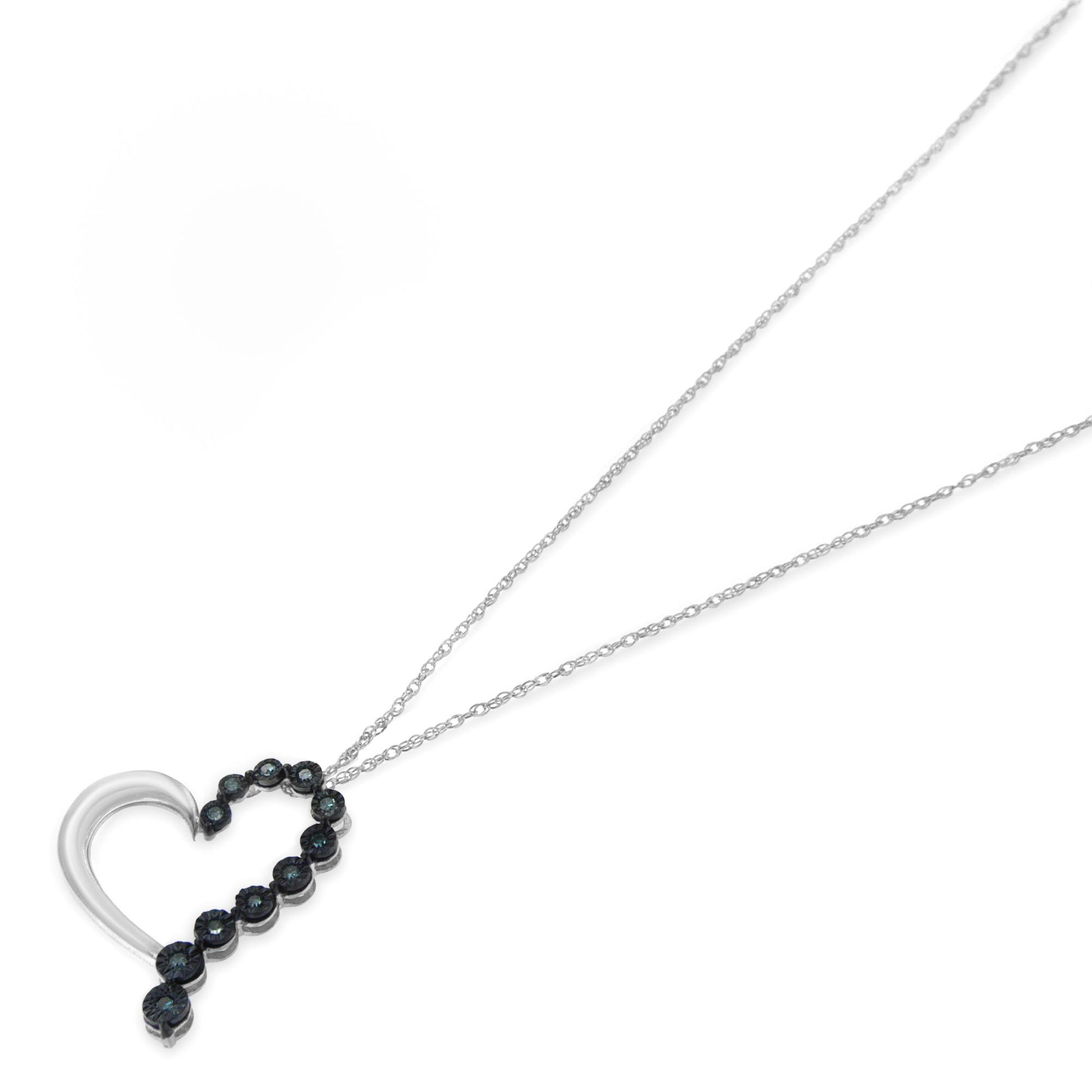 White metal necklace with a heart-shaped pendant featuring round blue gemstones in a miracle setting, shown from a slightly angled top view.