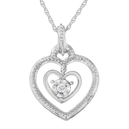 White metal heart-shaped necklace pendant with a smaller heart inside, featuring a round white gemstone in the center, shown in a front-facing close-up.