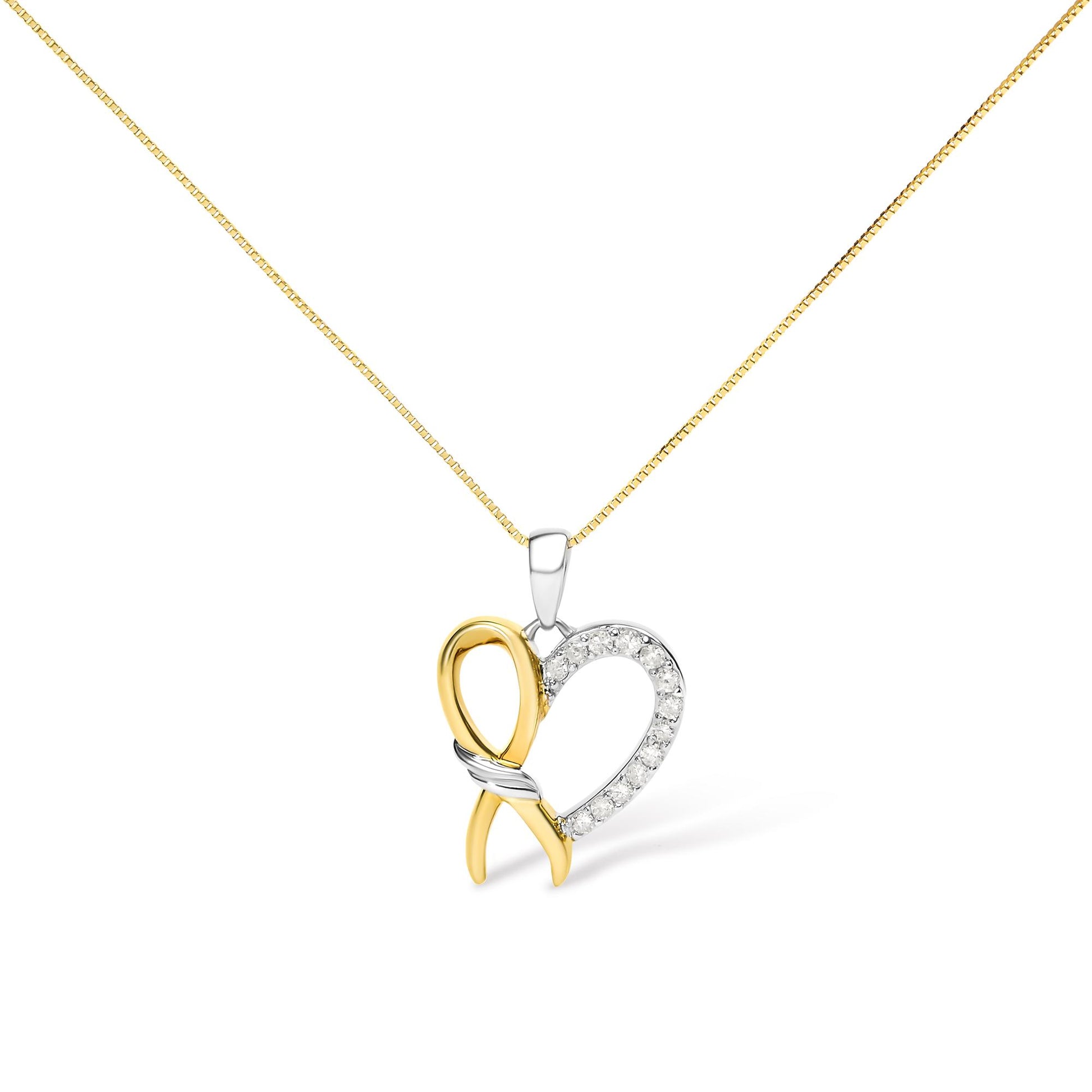 Front view of a necklace with a yellow and white metal heart-shaped pendant featuring round white gemstones in prong settings on one side.