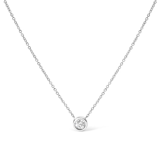 Front view of a white metal necklace featuring a round bezel-set white gemstone pendant.