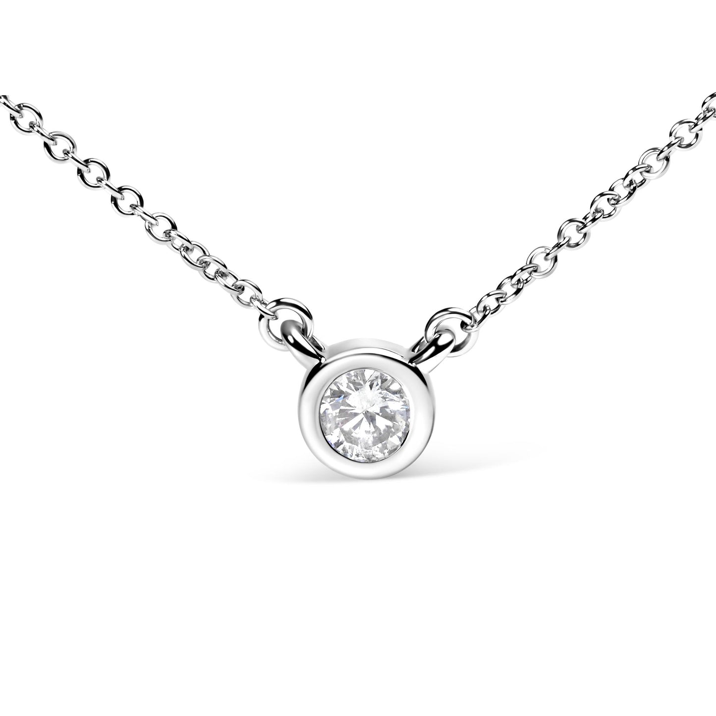 Close-up front view of a white metal necklace with a round bezel-set white gemstone pendant.