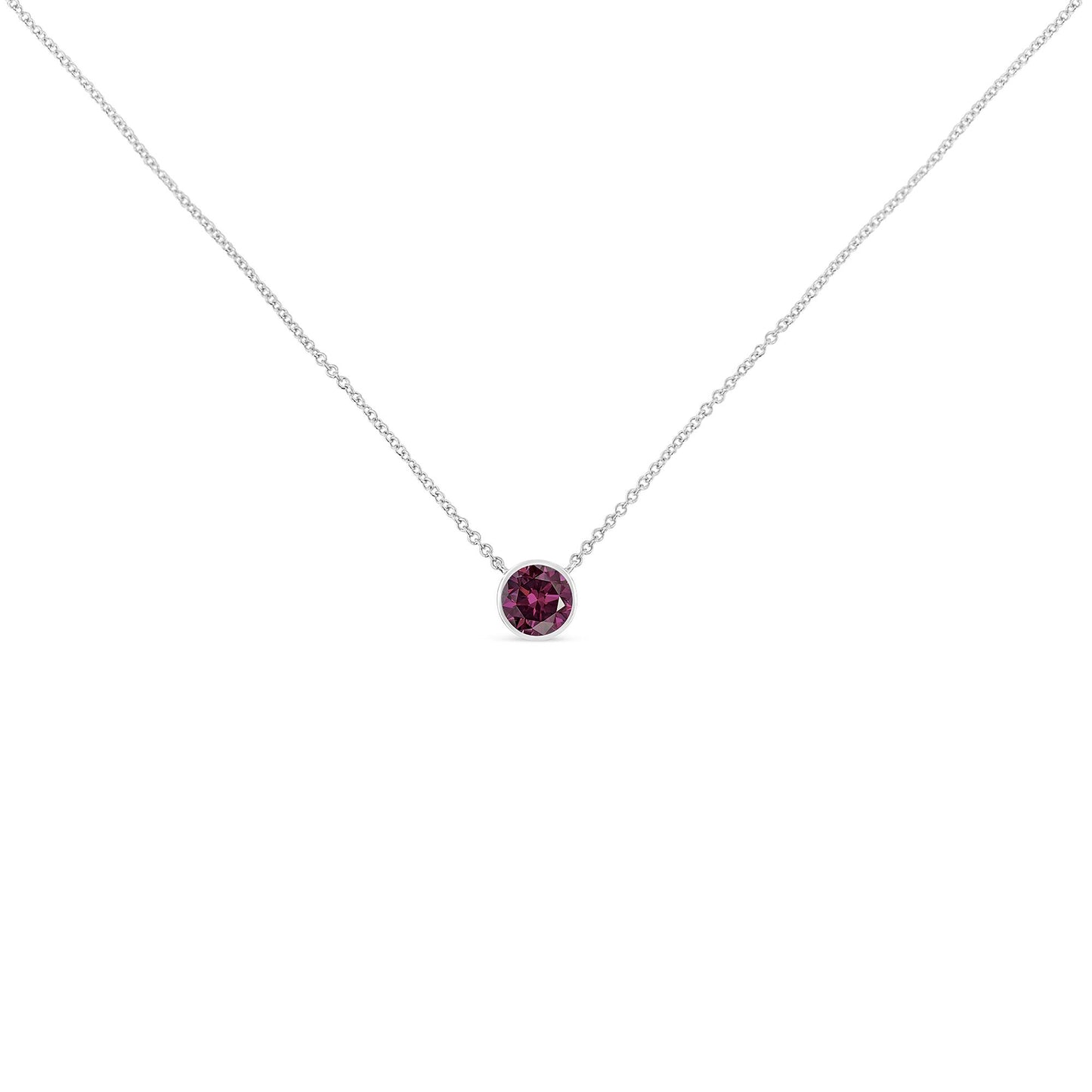 Front view of a white necklace with a single round purple gemstone in a bezel setting at the center.