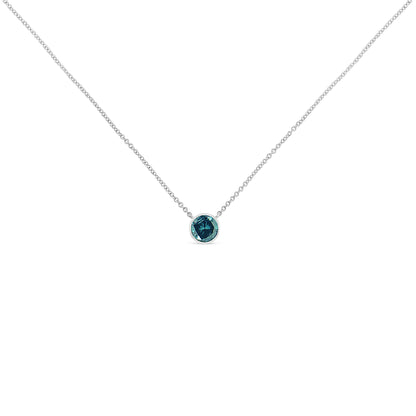 Front view of a white metal necklace with a single round blue gemstone in a bezel setting.