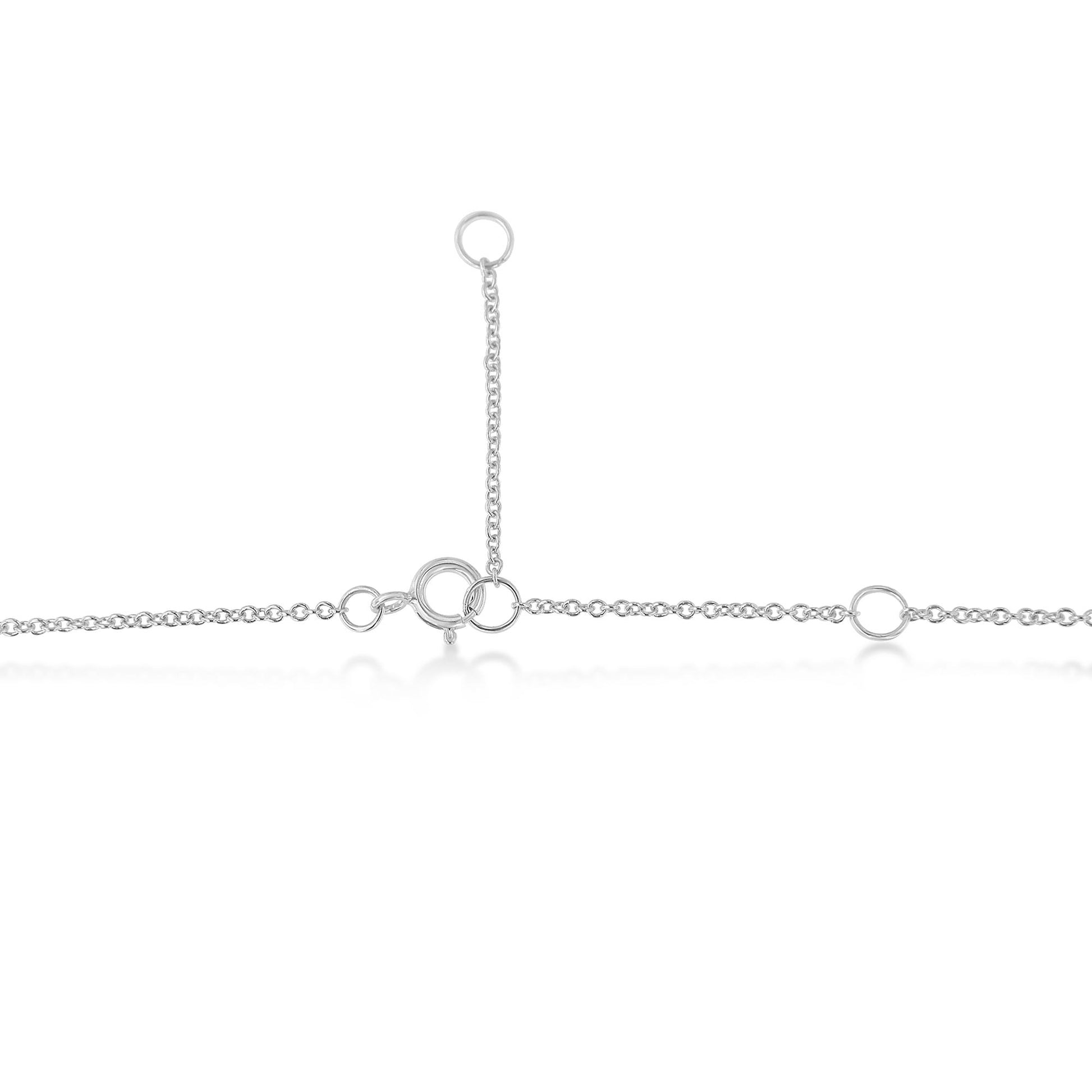 Close-up angled view of a white metal necklace chain with circular links and a clasp.