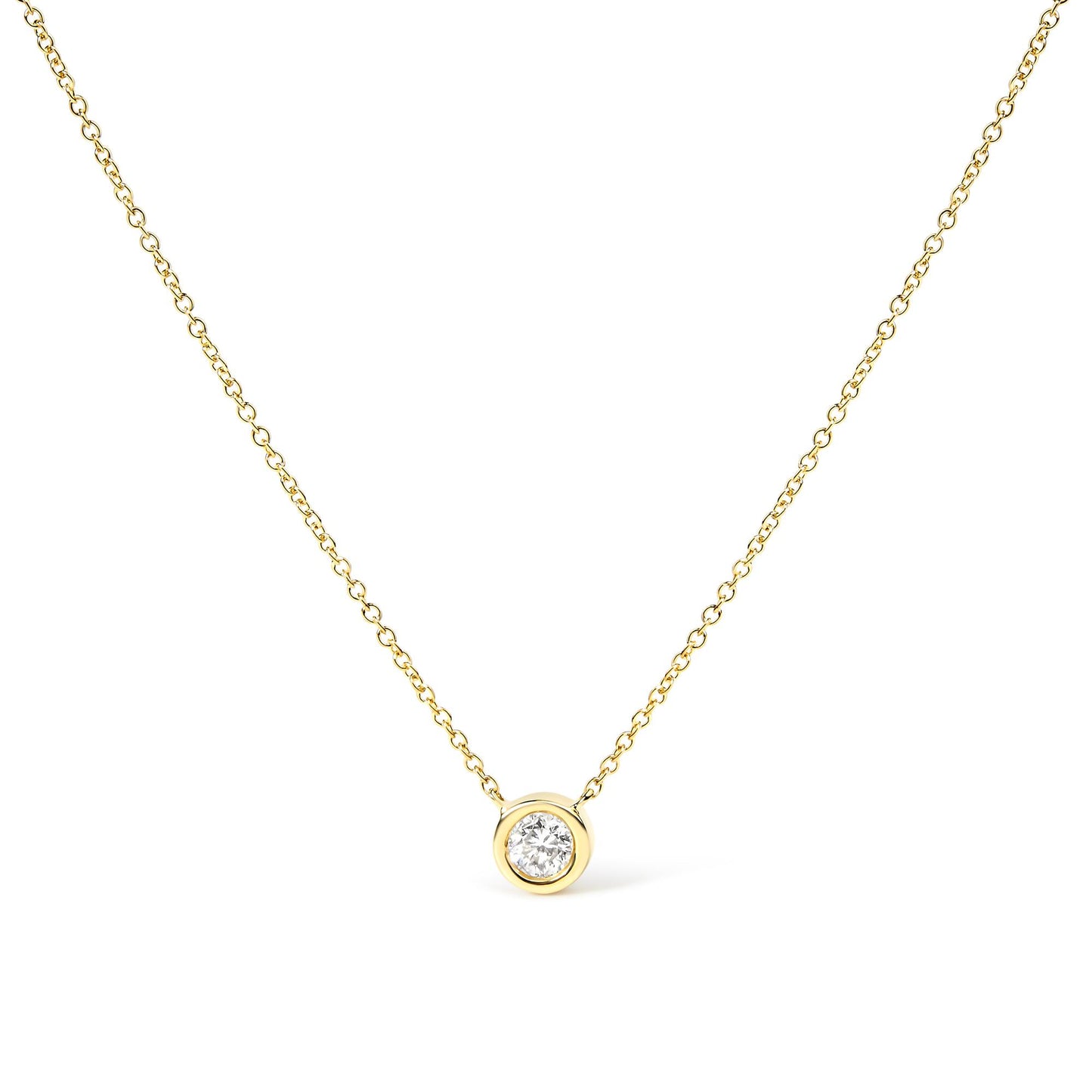 Front-facing close-up of a yellow metal necklace with a single round white gemstone in bezel setting pendant.
