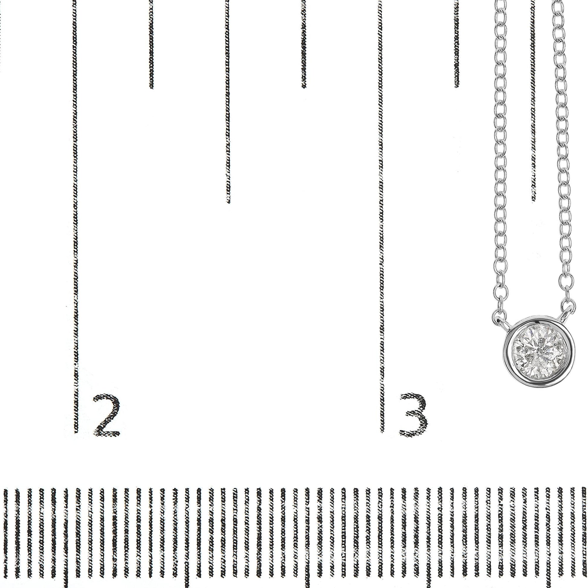 Close-up front view of a white necklace with a round white gemstone in a bezel setting, placed on a ruler for size reference.