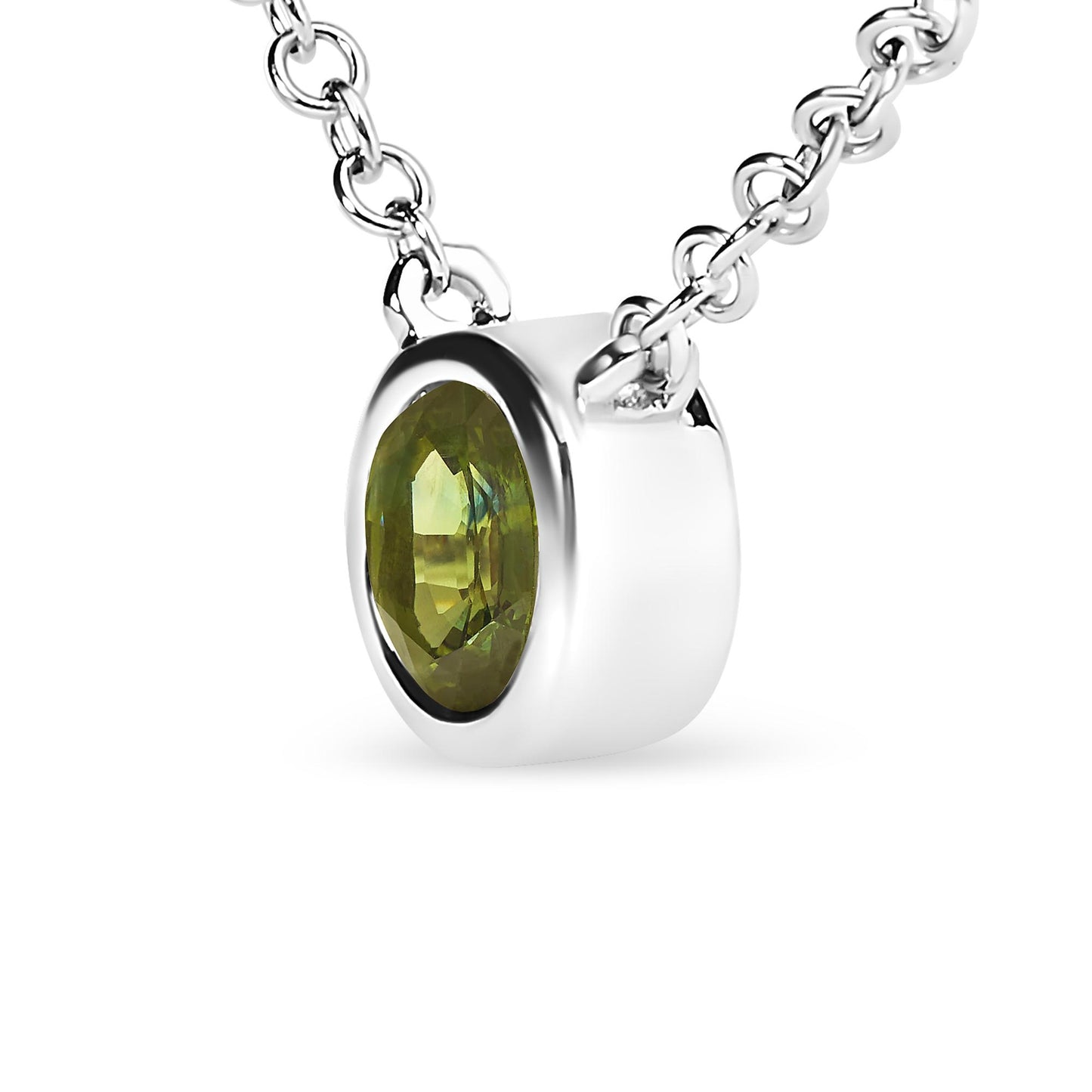 Close-up front angled view of white metal necklace with a round green gemstone in bezel setting on a chain.