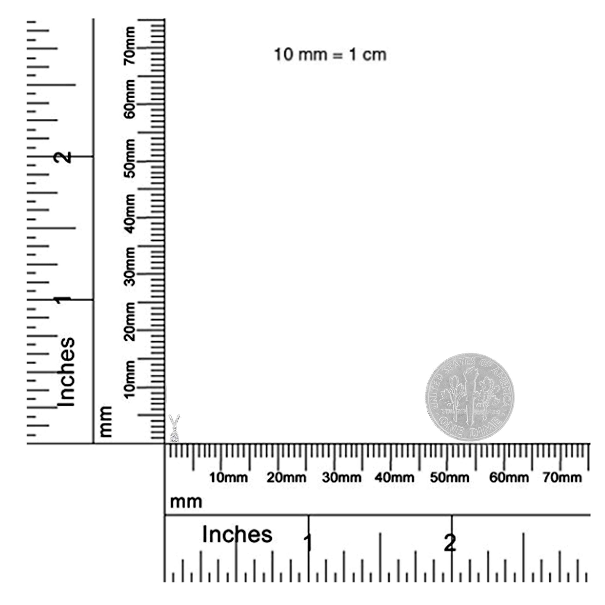 White metal necklace with a pear-shaped white gemstone pendant in a prong setting, shown on a ruler for size reference, viewed from the front.