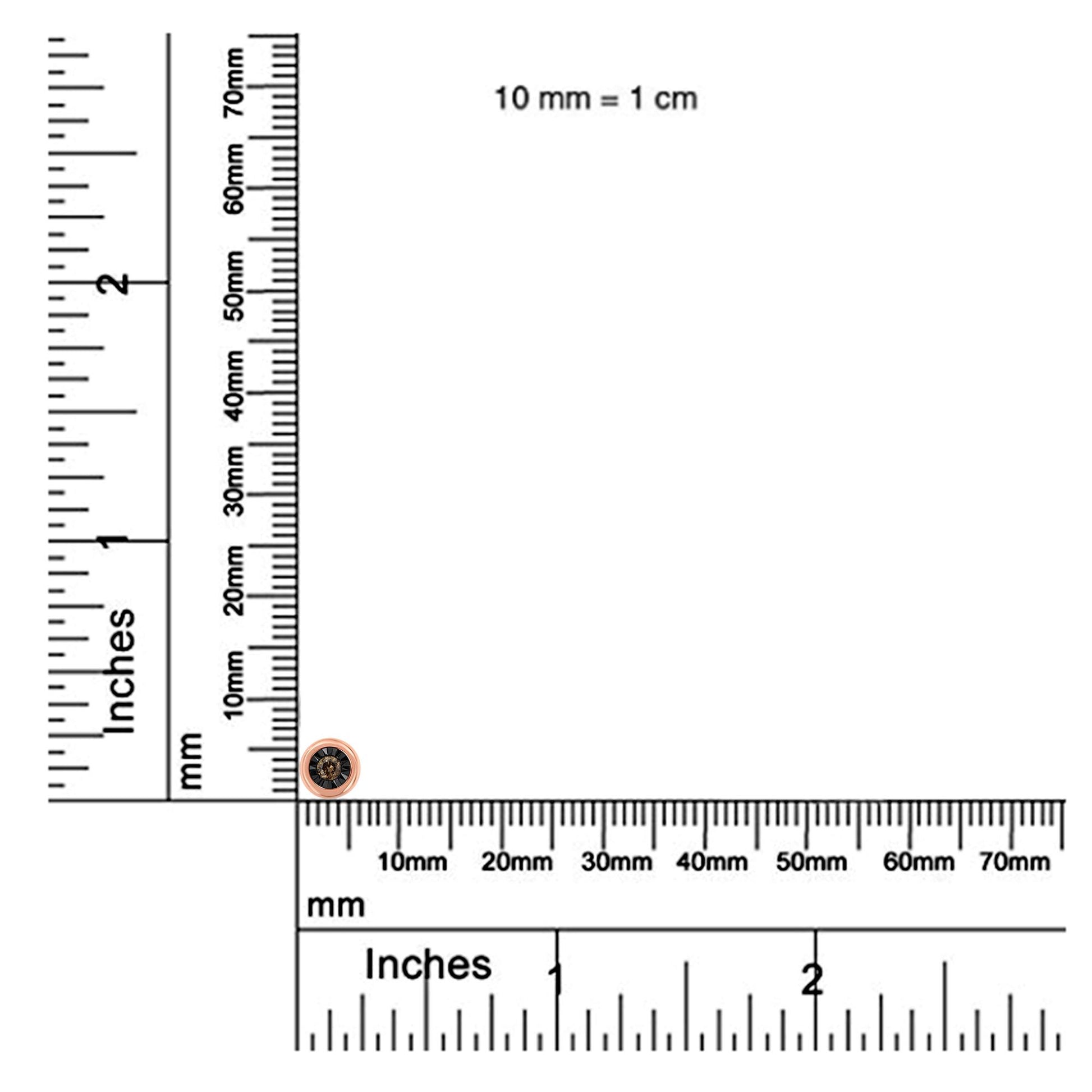 Rose metal round necklace with a single champagne-colored gemstone in miracle setting, photographed on a ruler for size reference from top left angle.