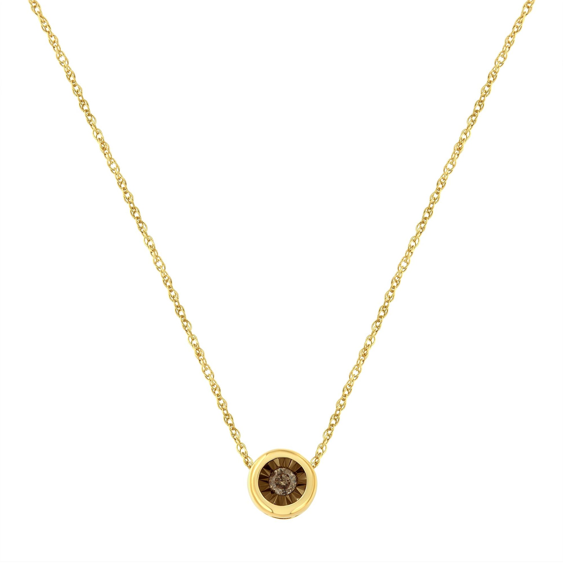 Yellow metal necklace with round brownish gemstone in miracle setting, front view.