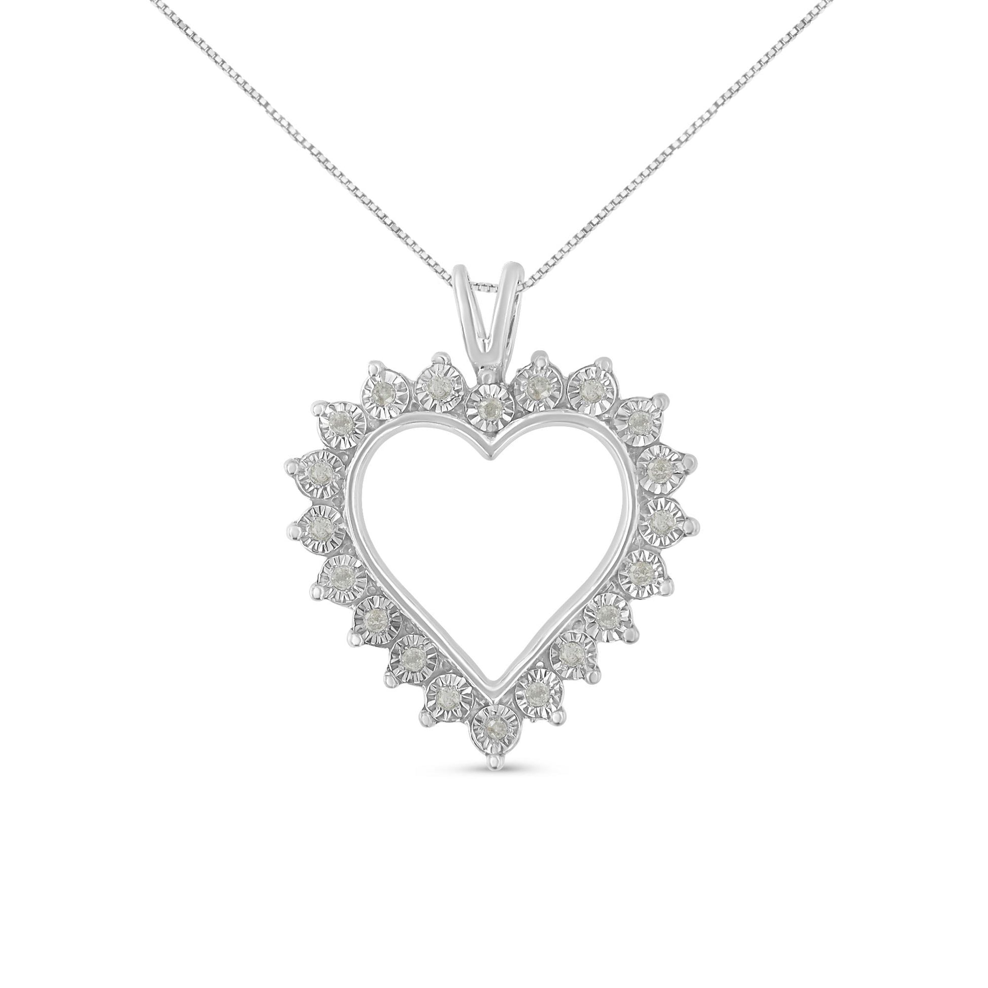 Front-facing image of a white metal heart-shaped necklace pendant with round white gemstones in a miracle setting around the perimeter.