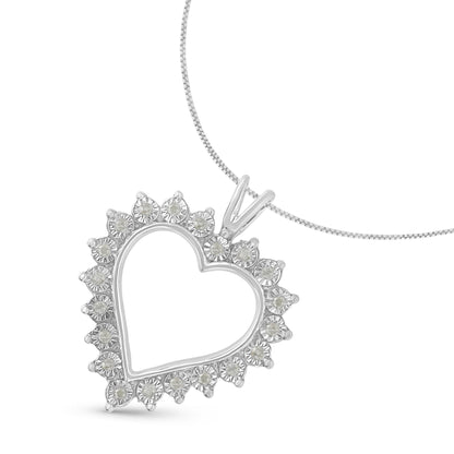Close-up front angle of a white metal heart-shaped necklace pendant with round white gemstones in miracle setting around the open heart outline on a chain.